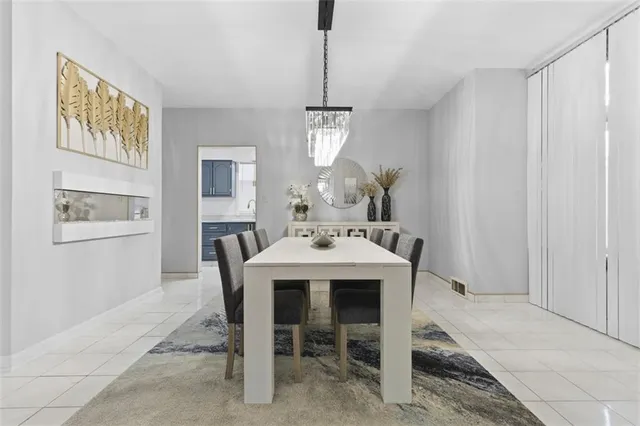 a dining room with furniture and window