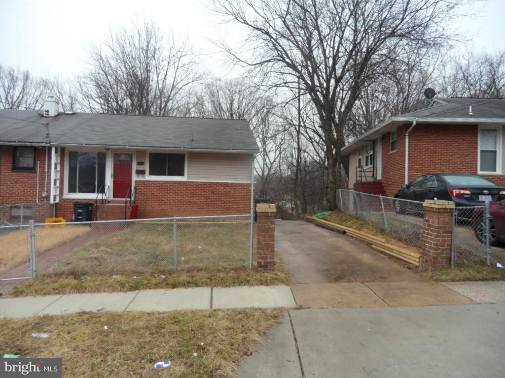 7855 Burnside Road Landover, MD 20785 - Photo 1 of 17 a front view of a house with garden