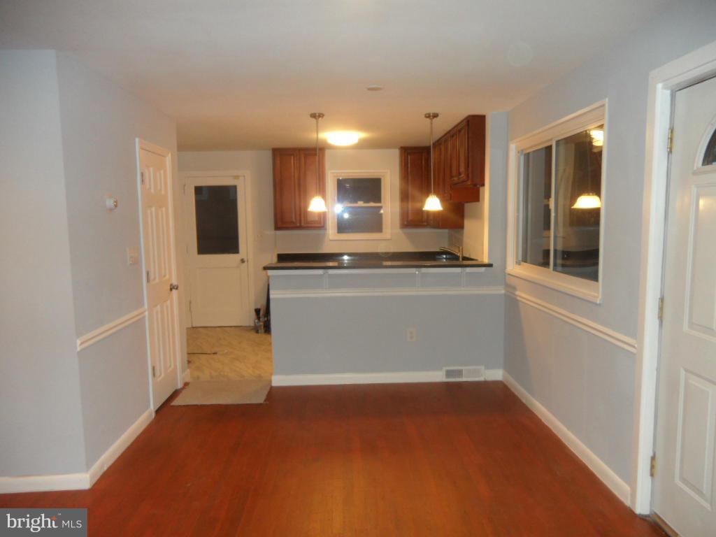 7855 Burnside Road Landover, MD 20785 - Photo 2 of 17 a view of a kitchen with a refrigerator and a sink
