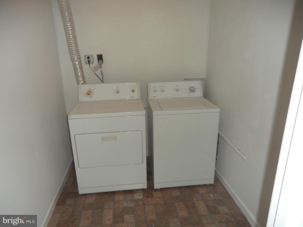 7855 Burnside Road Landover, MD 20785 - Photo 14 of 17 a utility room with dryer and washer