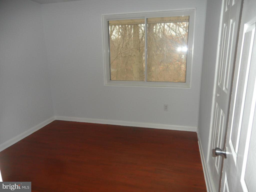 7855 Burnside Road Landover, MD 20785 - Photo 7 of 17 an empty room with a window