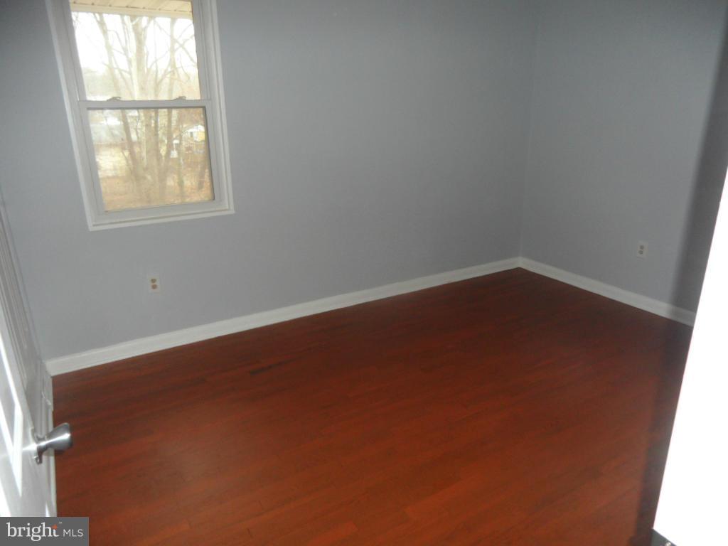 7855 Burnside Road Landover, MD 20785 - Photo 8 of 17 an empty room with a window