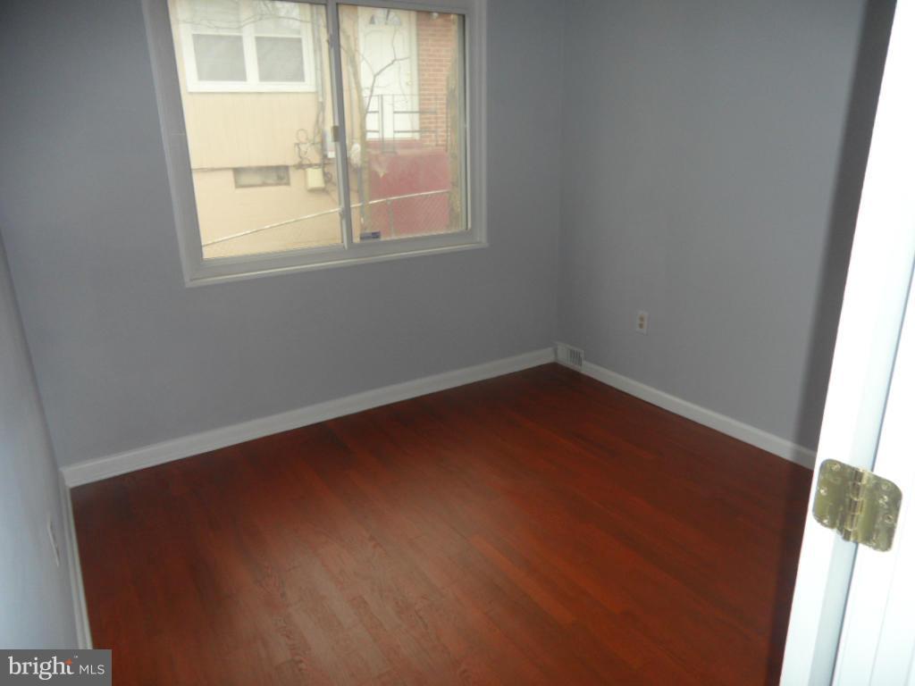 7855 Burnside Road Landover, MD 20785 - Photo 9 of 17 an empty room with a window