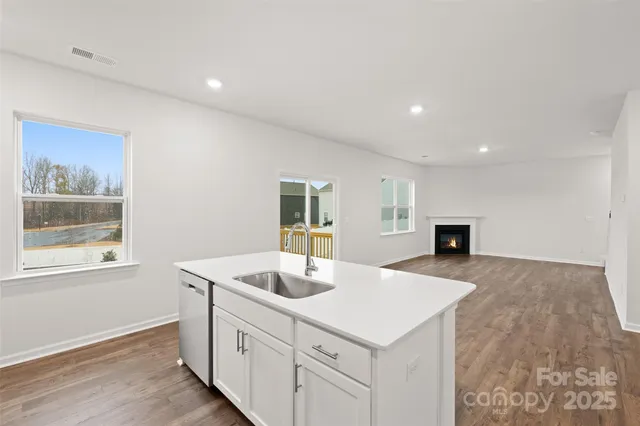 a kitchen with sink and microwave