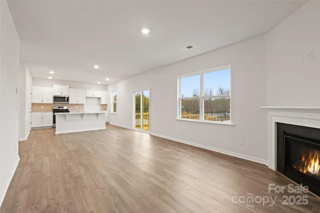 a view of kitchen with furniture and fireplace