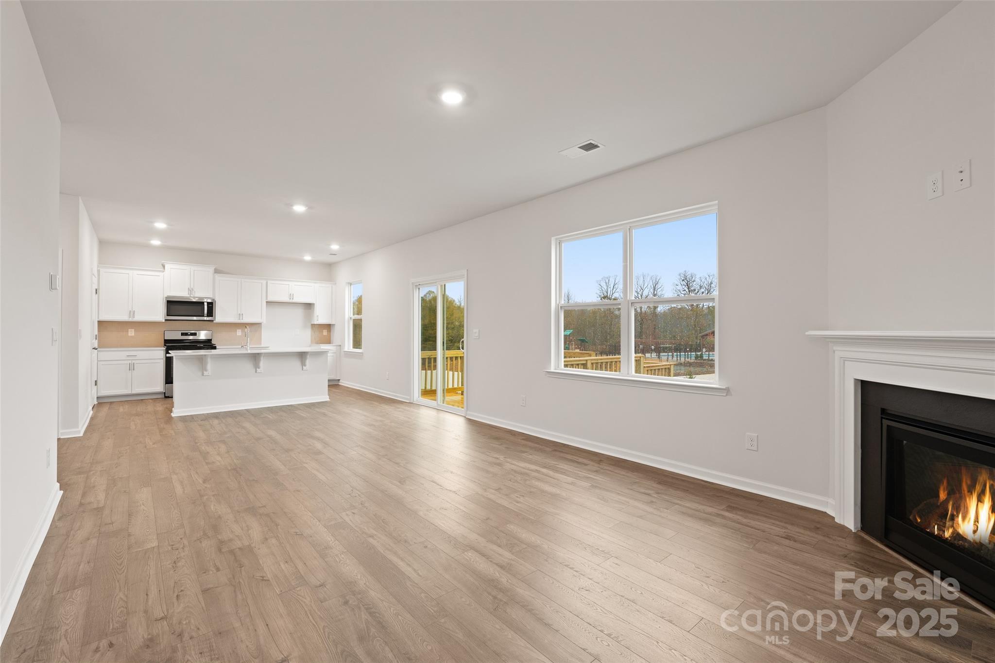 52 Shorthorn Road Fletcher, NC 28732 - Photo 7 of 28 a view of kitchen with furniture and fireplace