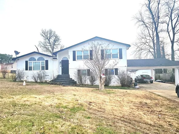 a front view of a house with a patio