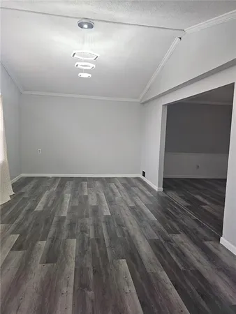 a view of room with wooden floor