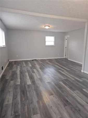 a view of an empty room and window