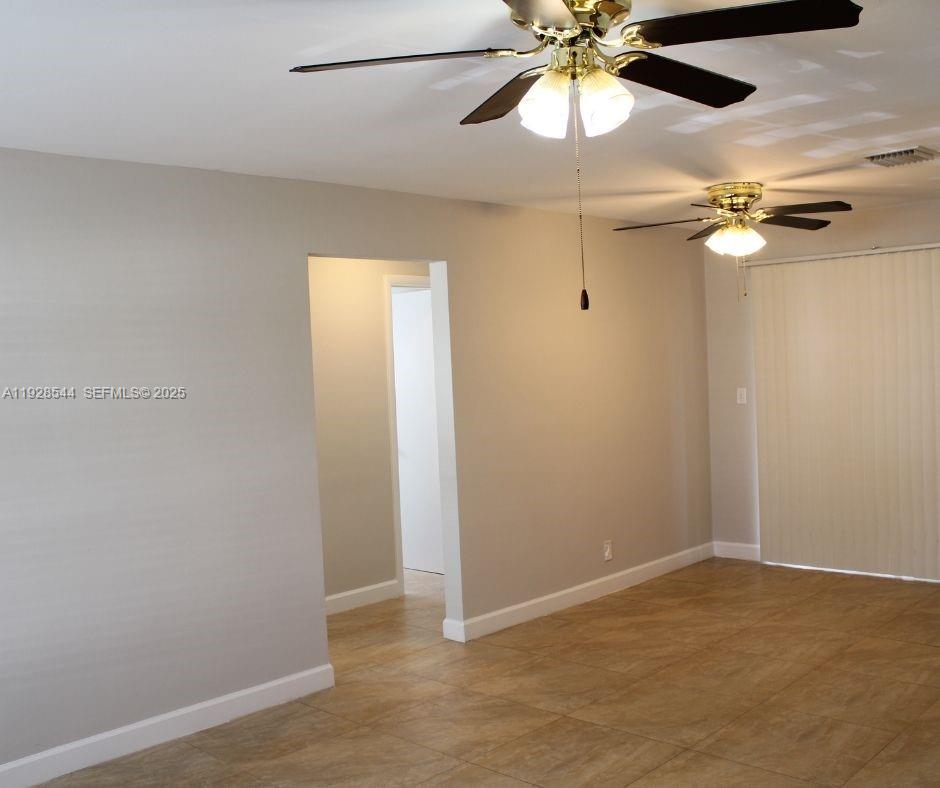 5709 Northwest 64th Way Tamarac, FL 33321 - Photo 13 of 51 wooden floor in an empty room