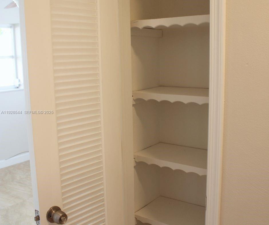 5709 Northwest 64th Way Tamarac, FL 33321 - Photo 19 of 51 a bathroom with a toilet