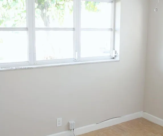 a view of a window in an empty room
