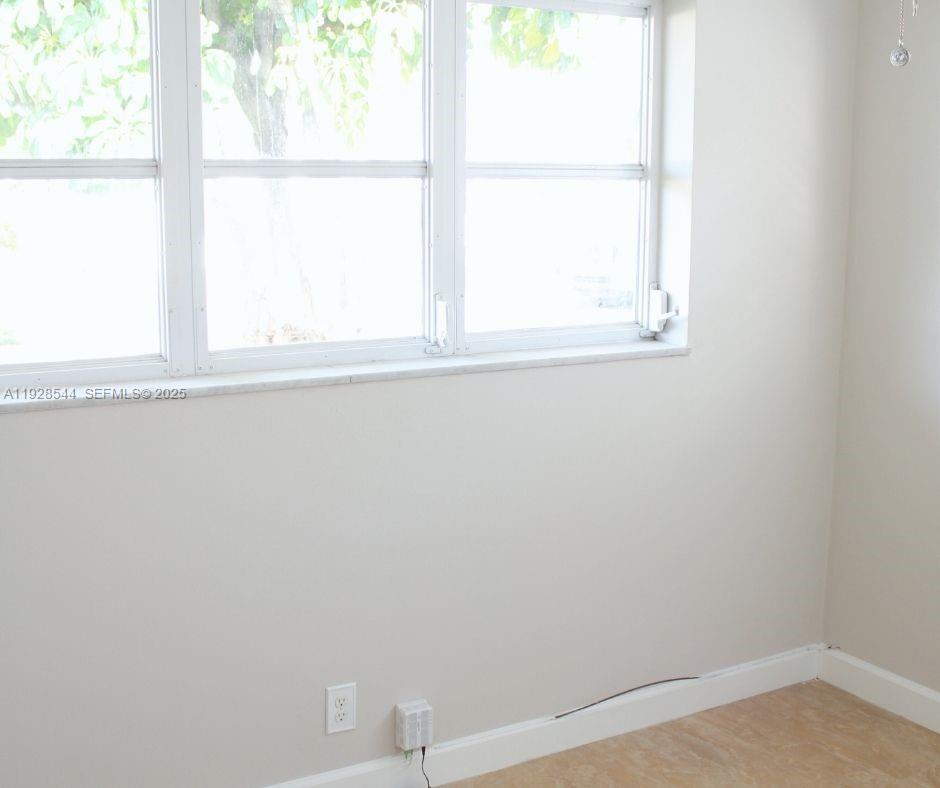 5709 Northwest 64th Way Tamarac, FL 33321 - Photo 26 of 51 a view of a window in an empty room