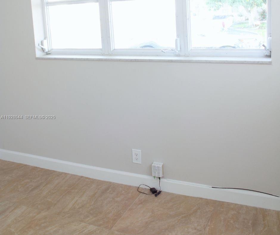 5709 Northwest 64th Way Tamarac, FL 33321 - Photo 28 of 51 a view of a window in a room