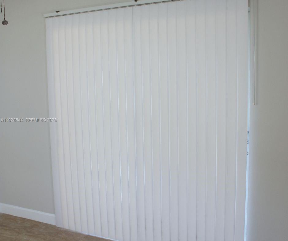 5709 Northwest 64th Way Tamarac, FL 33321 - Photo 30 of 51 a close up view of a curtain