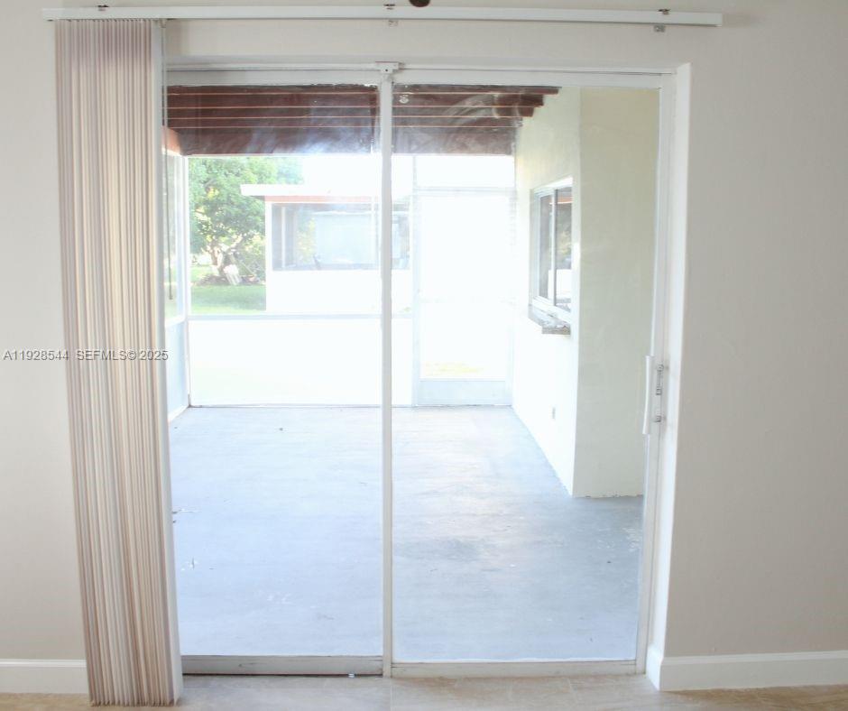 5709 Northwest 64th Way Tamarac, FL 33321 - Photo 32 of 51 a view of a glass door with a glass door