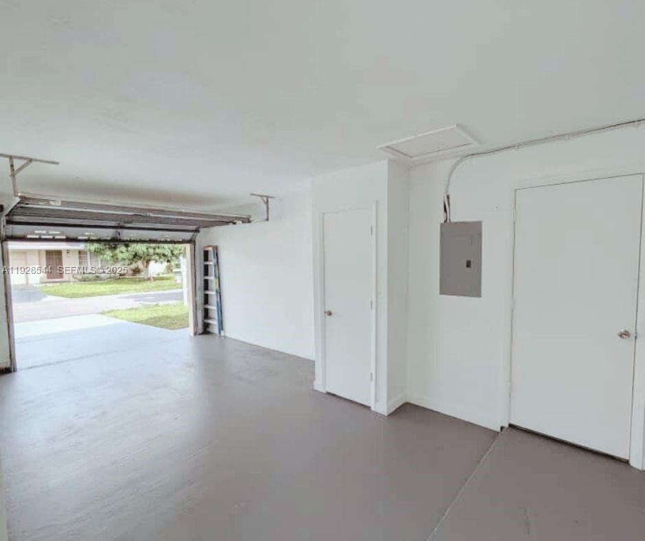 5709 Northwest 64th Way Tamarac, FL 33321 - Photo 42 of 51 a view of an empty room with a window