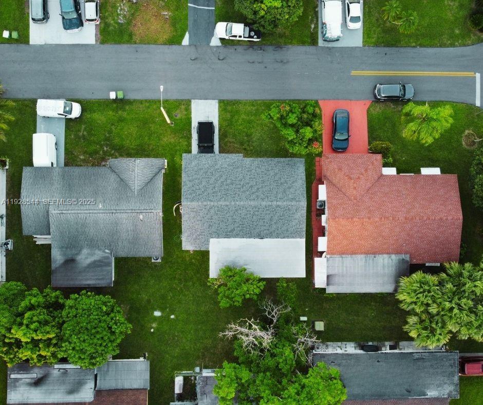 5709 Northwest 64th Way Tamarac, FL 33321 - Photo 43 of 51 an aerial view of a house with garden space and a street view