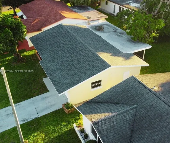 an aerial view of a house having patio