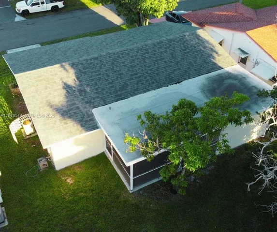 aerial view of a house with garden