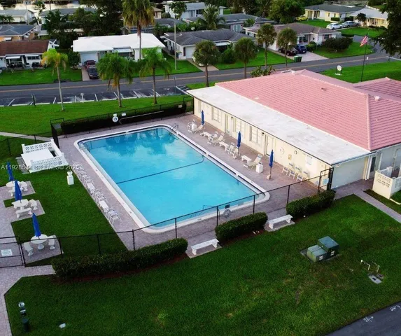 aerial view of a tennis ground with large trees