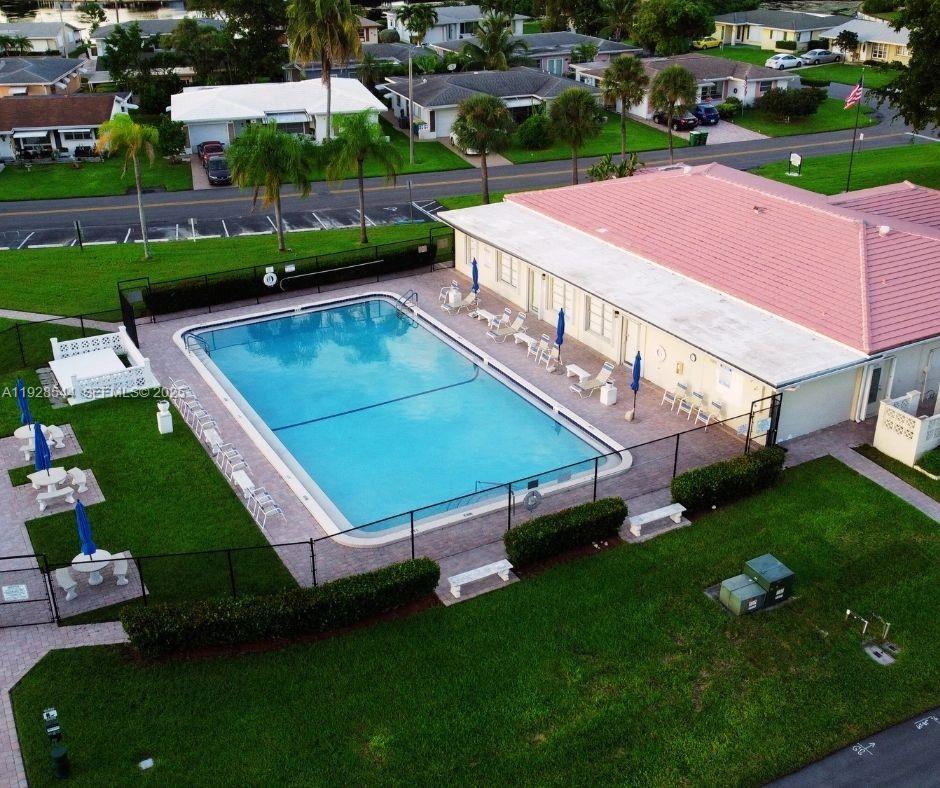 5709 Northwest 64th Way Tamarac, FL 33321 - Photo 47 of 51 an aerial view of a tennis ground and a cars park side of the road