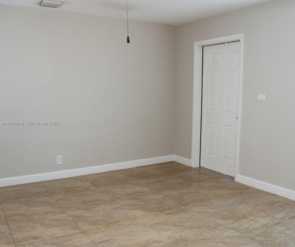 5709 Northwest 64th Way Tamarac, FL 33321 - Photo 7 of 51 a view of an empty room
