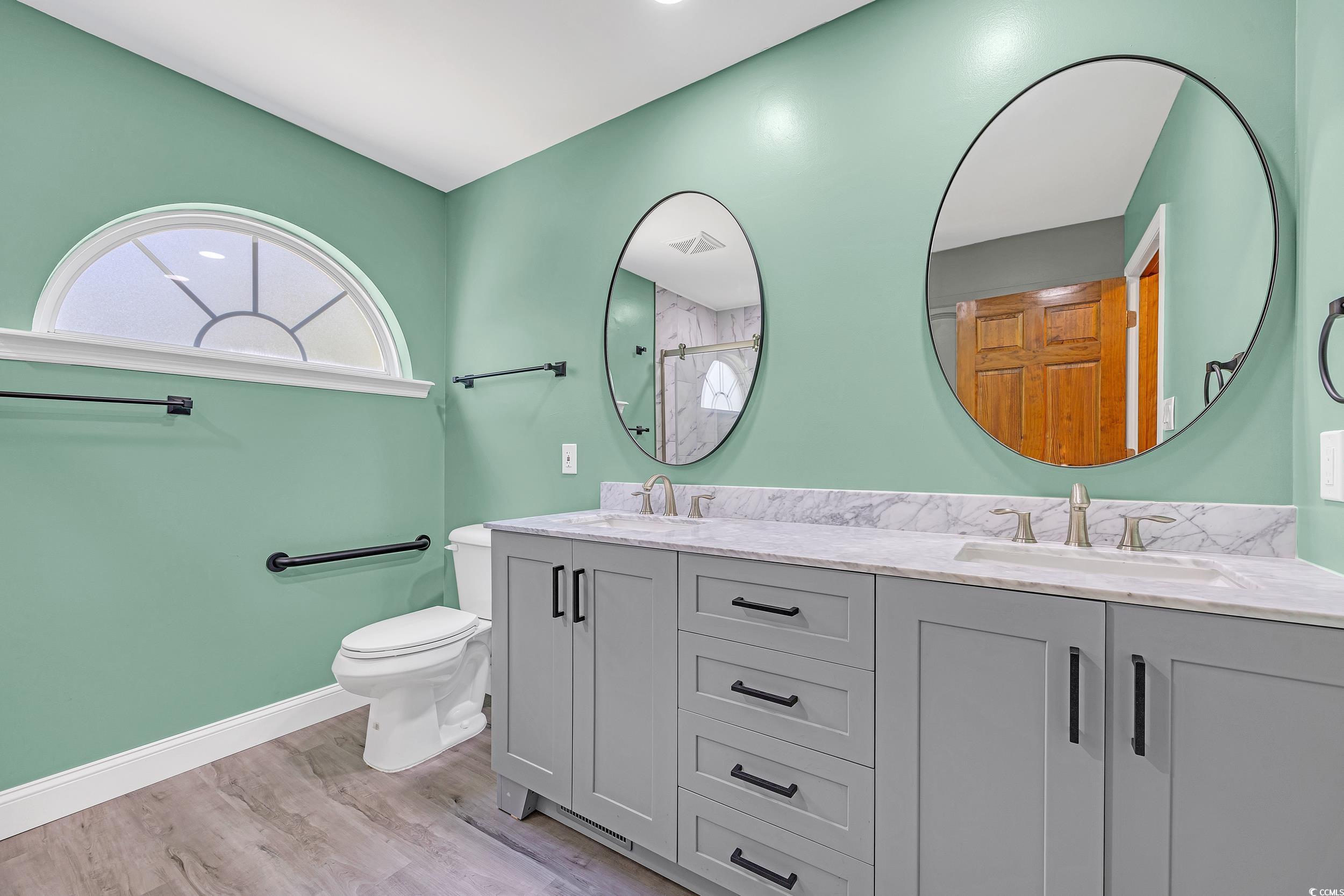 1014 Academy Drive Conway, SC 29526 - Photo 20 of 40 Bathroom featuring a sink, baseboards, toilet, and