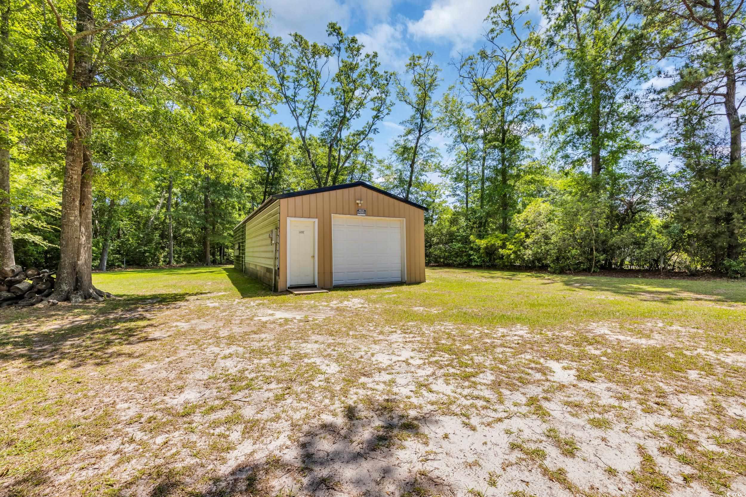 1014 Academy Drive Conway, SC 29526 - Photo 25 of 40 Detached garage featuring driveway