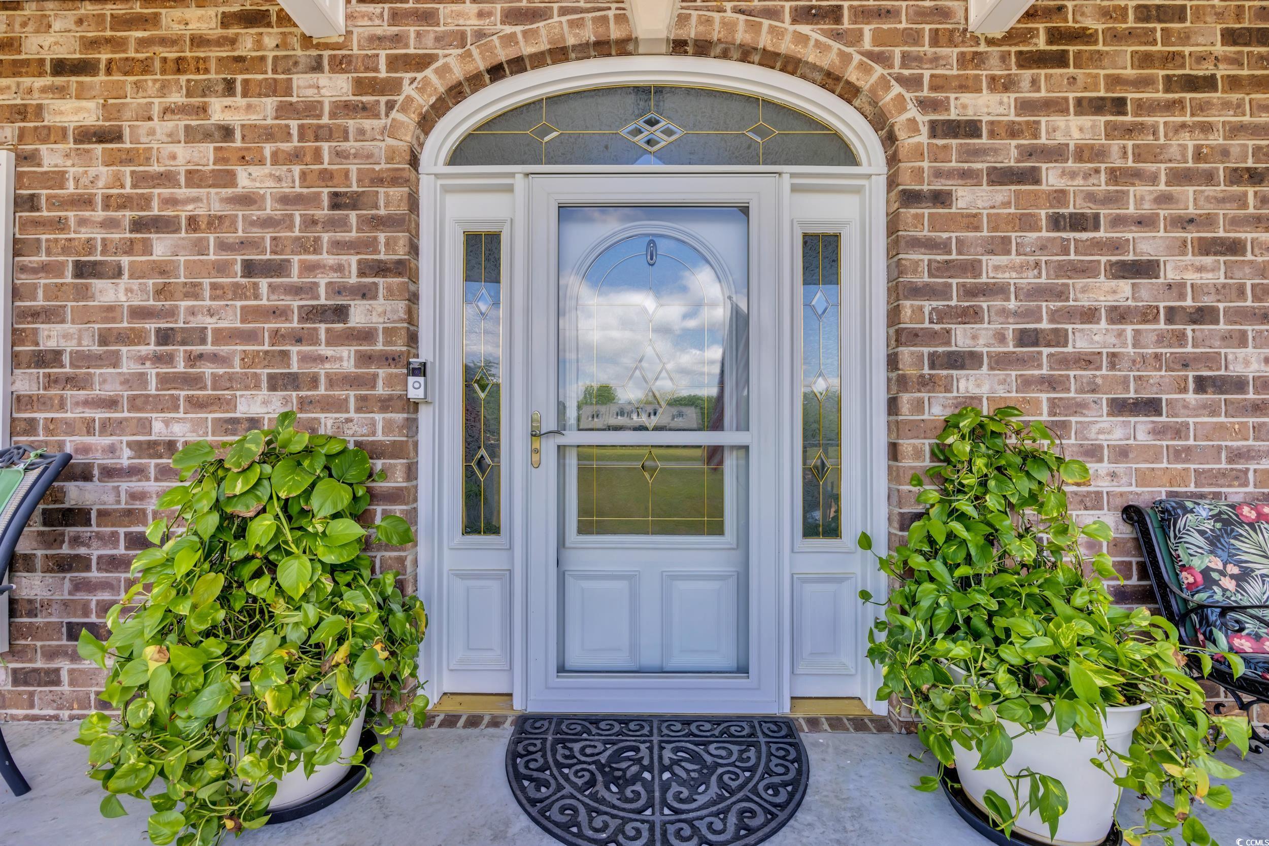 1014 Academy Drive Conway, SC 29526 - Photo 28 of 40 Doorway to property featuring brick siding