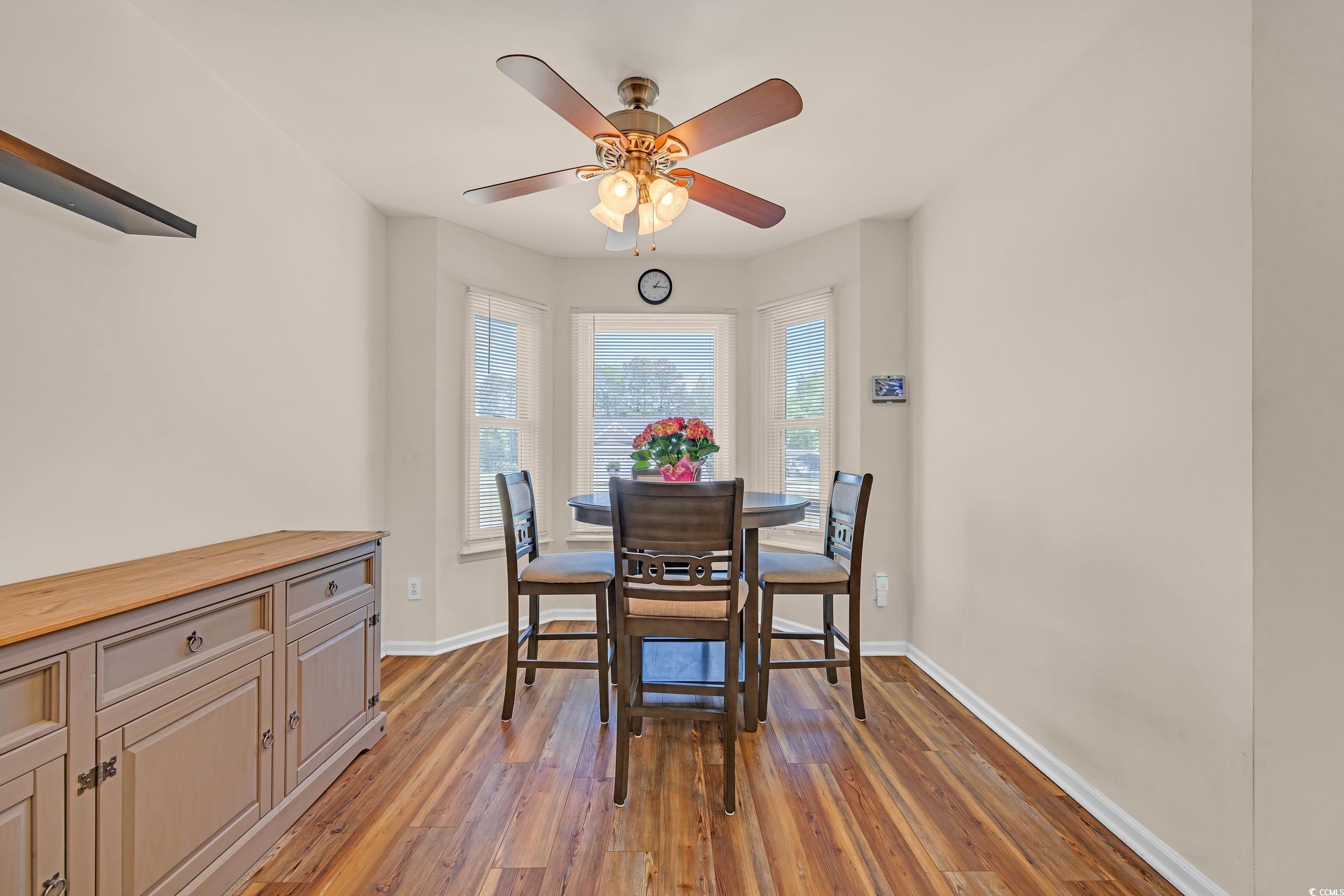 1014 Academy Drive Conway, SC 29526 - Photo 31 of 40 Dining room with a ceiling fan, baseboards, and wo