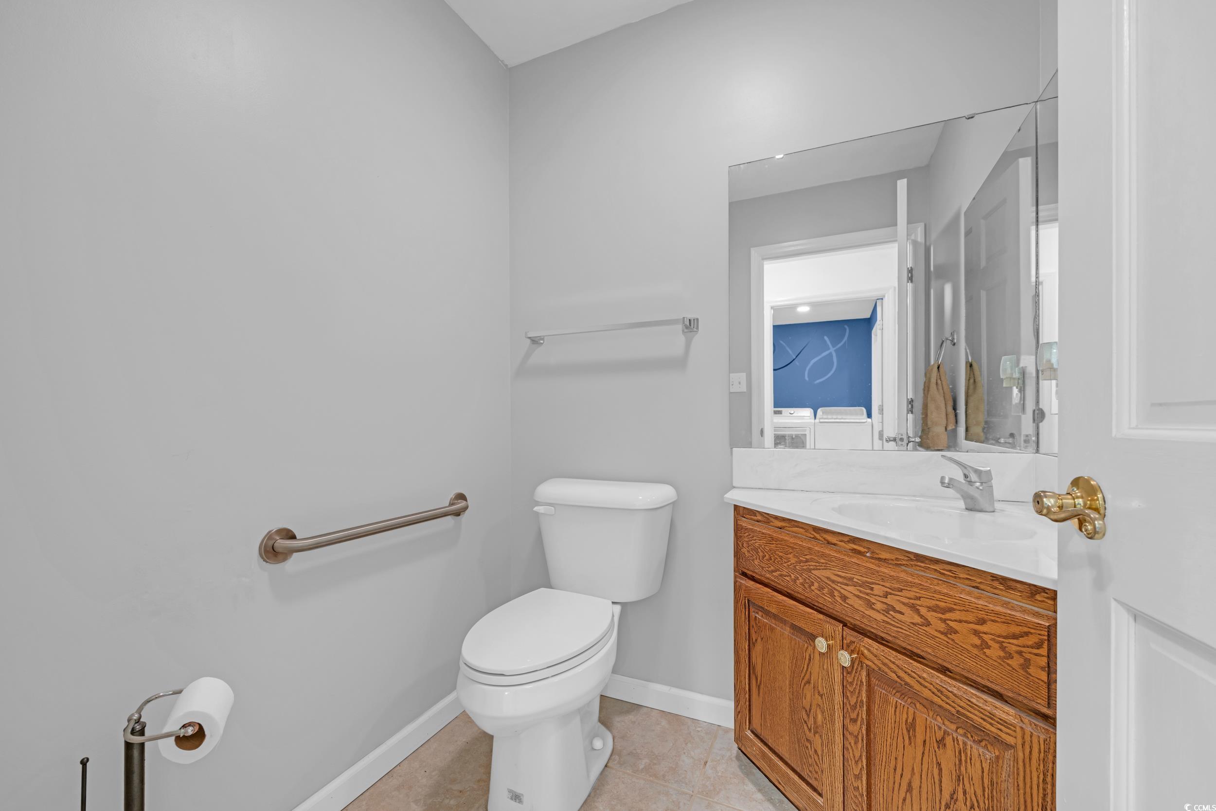 1014 Academy Drive Conway, SC 29526 - Photo 33 of 40 Bathroom featuring toilet, baseboards, tile patter