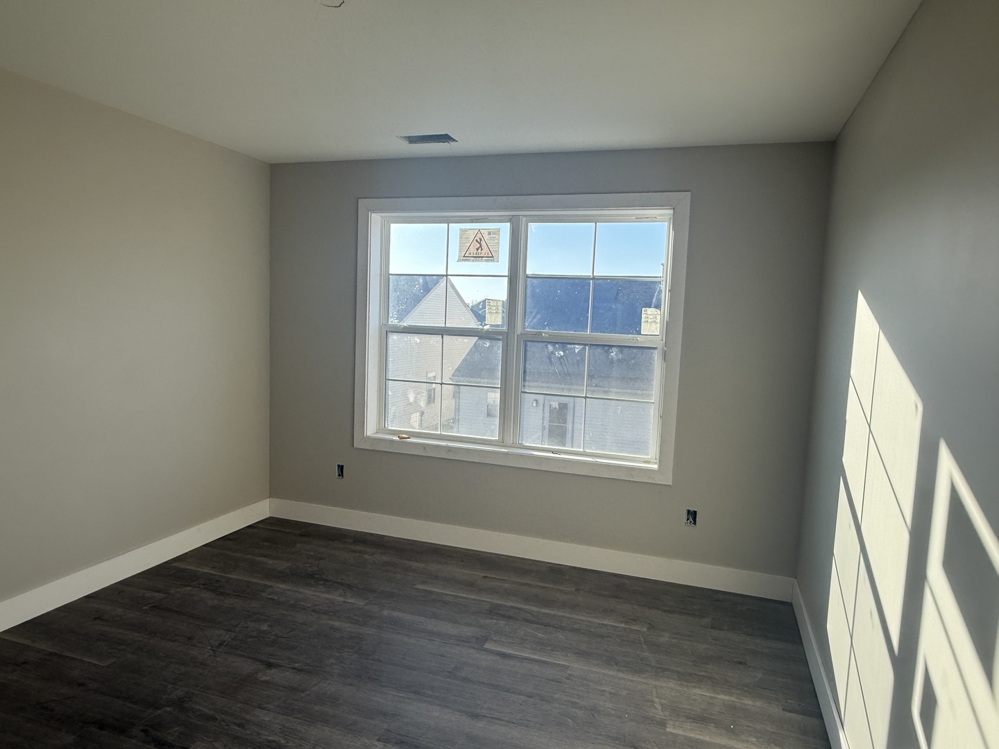 1409 Sand Dollar Drive Champaign, IL 61822 - Photo 11 of 12 an empty room with wooden floor and windows