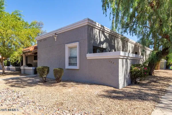 a backyard of a house with sofas