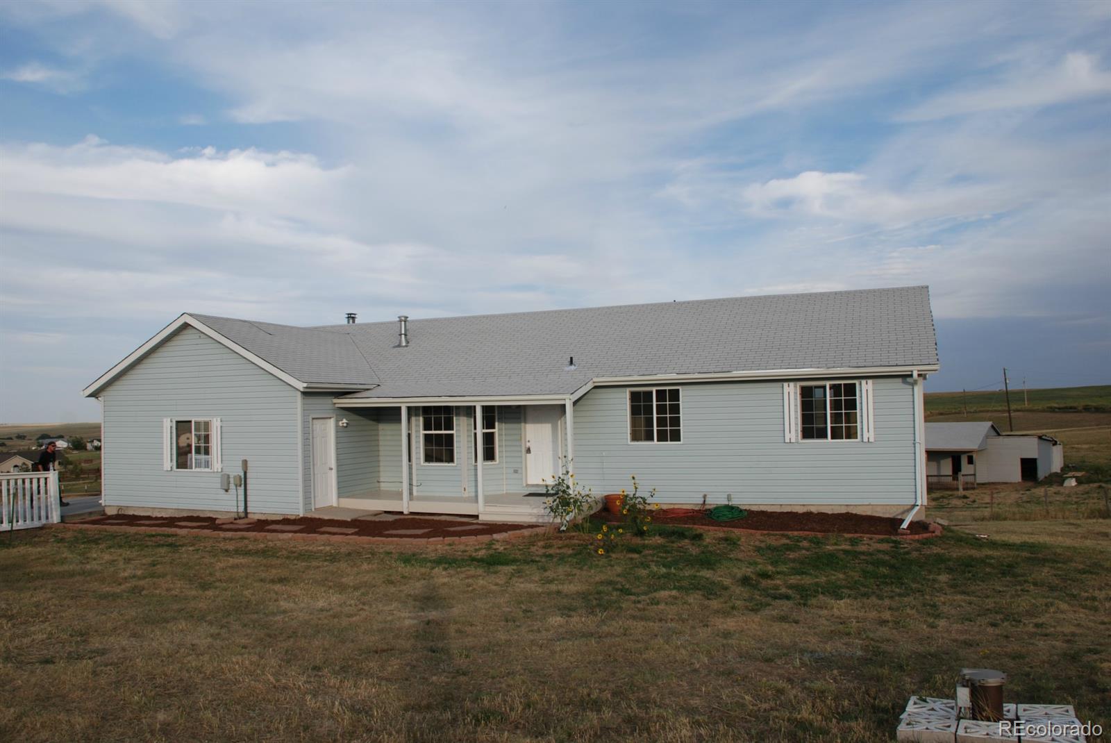 8979 Lariat Loop Elizabeth, CO 80107 - Photo 1 of 17 a house view with a garden space