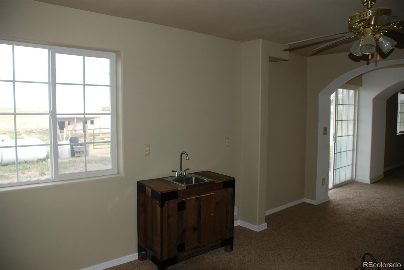 8979 Lariat Loop Elizabeth, CO 80107 - Photo 12 of 17 an empty room with a window