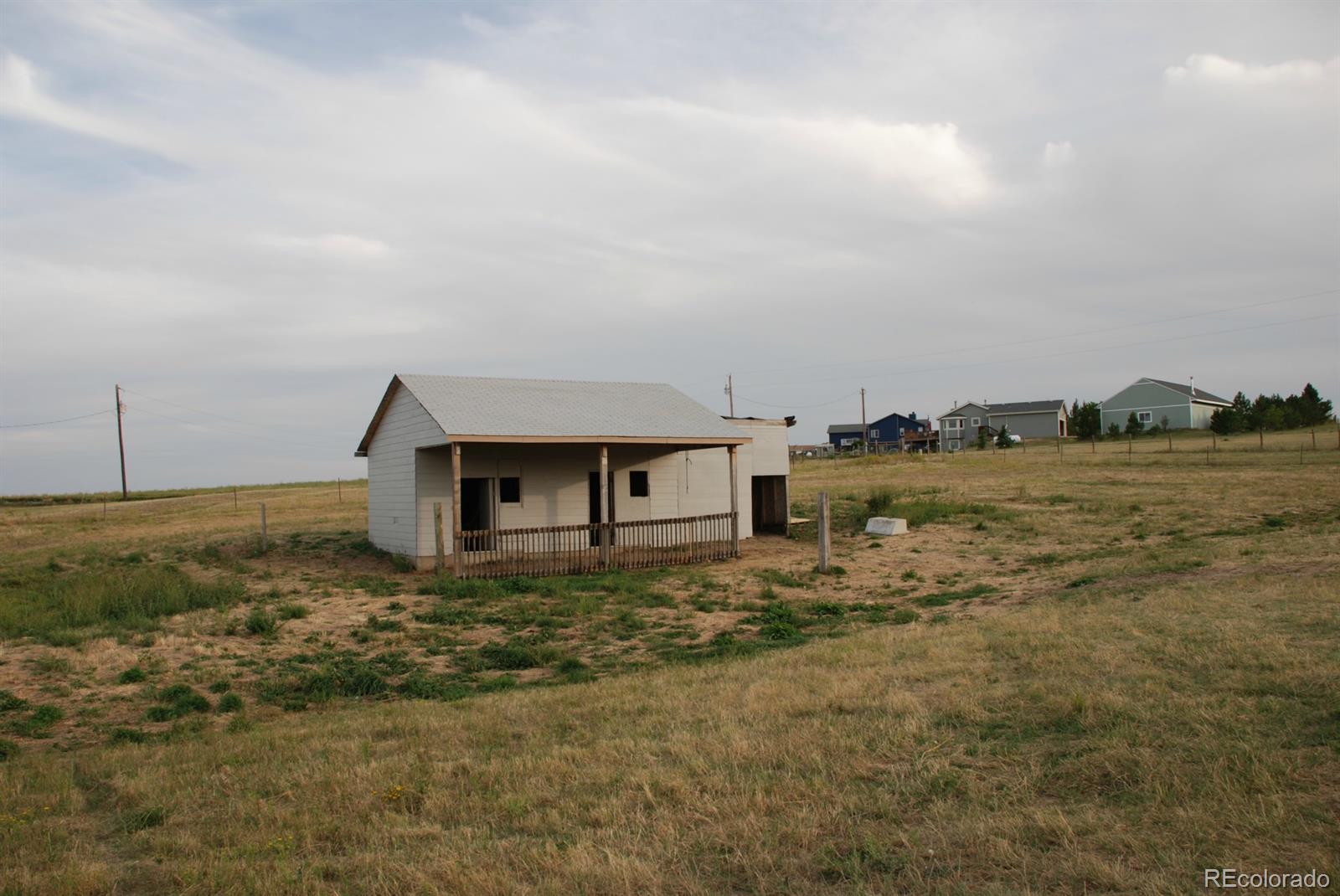 8979 Lariat Loop Elizabeth, CO 80107 - Photo 16 of 17 a view of a house with a yard
