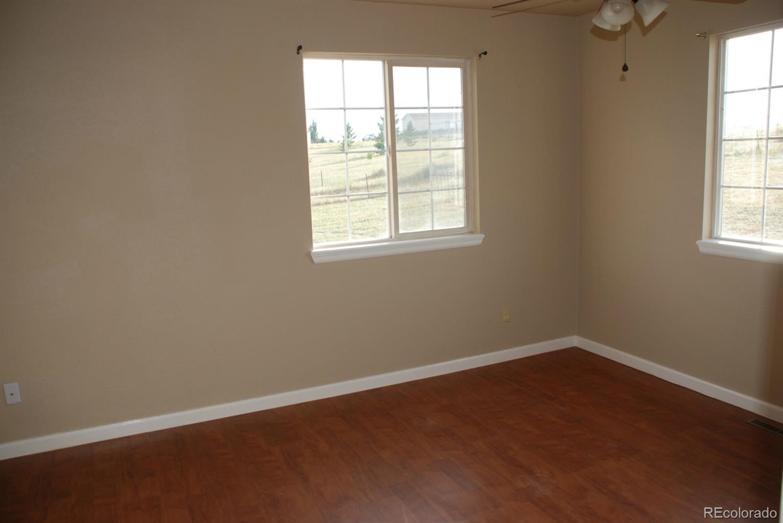 8979 Lariat Loop Elizabeth, CO 80107 - Photo 5 of 17 an empty room with a window