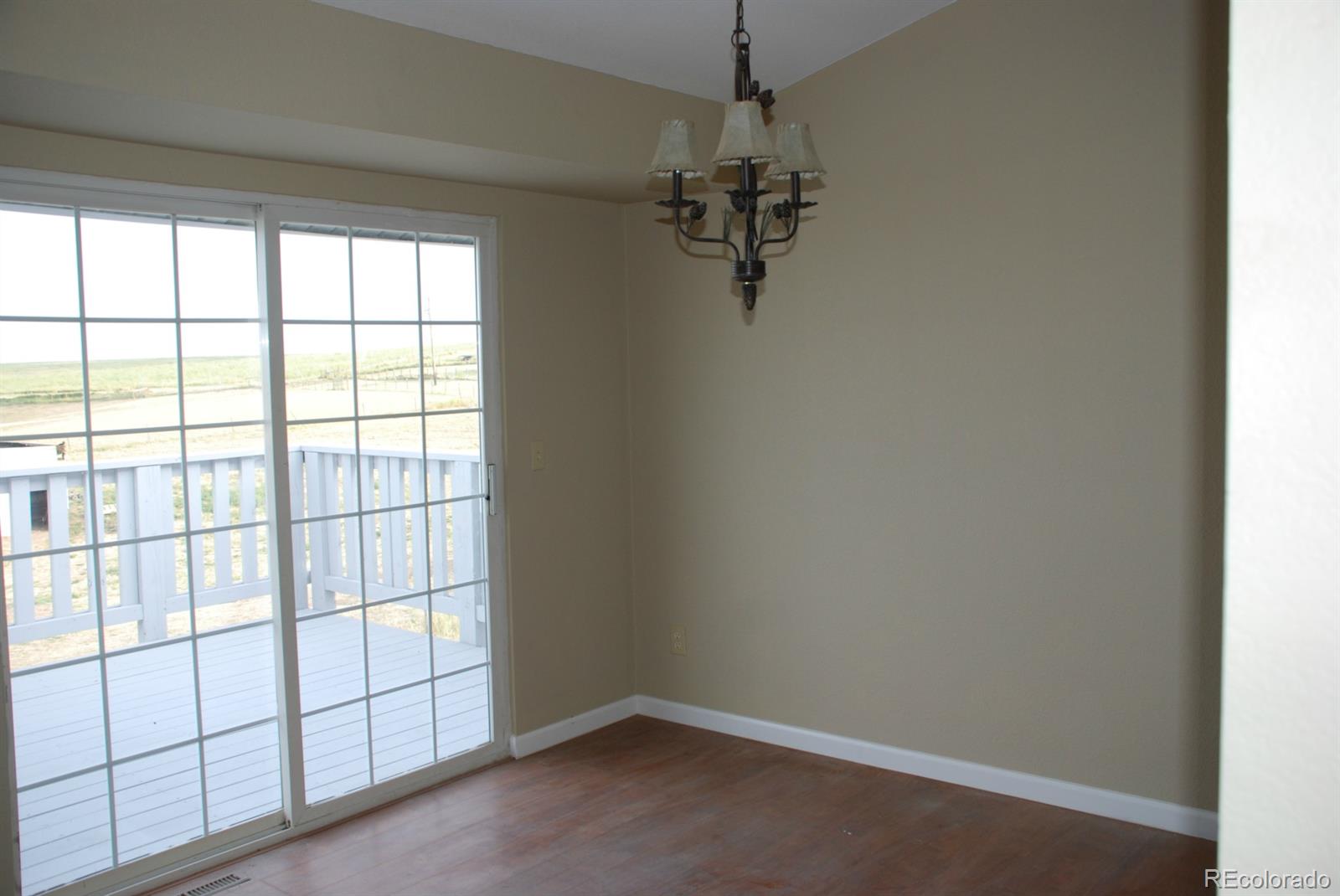 8979 Lariat Loop Elizabeth, CO 80107 - Photo 6 of 17 an empty room with a empty space and a window