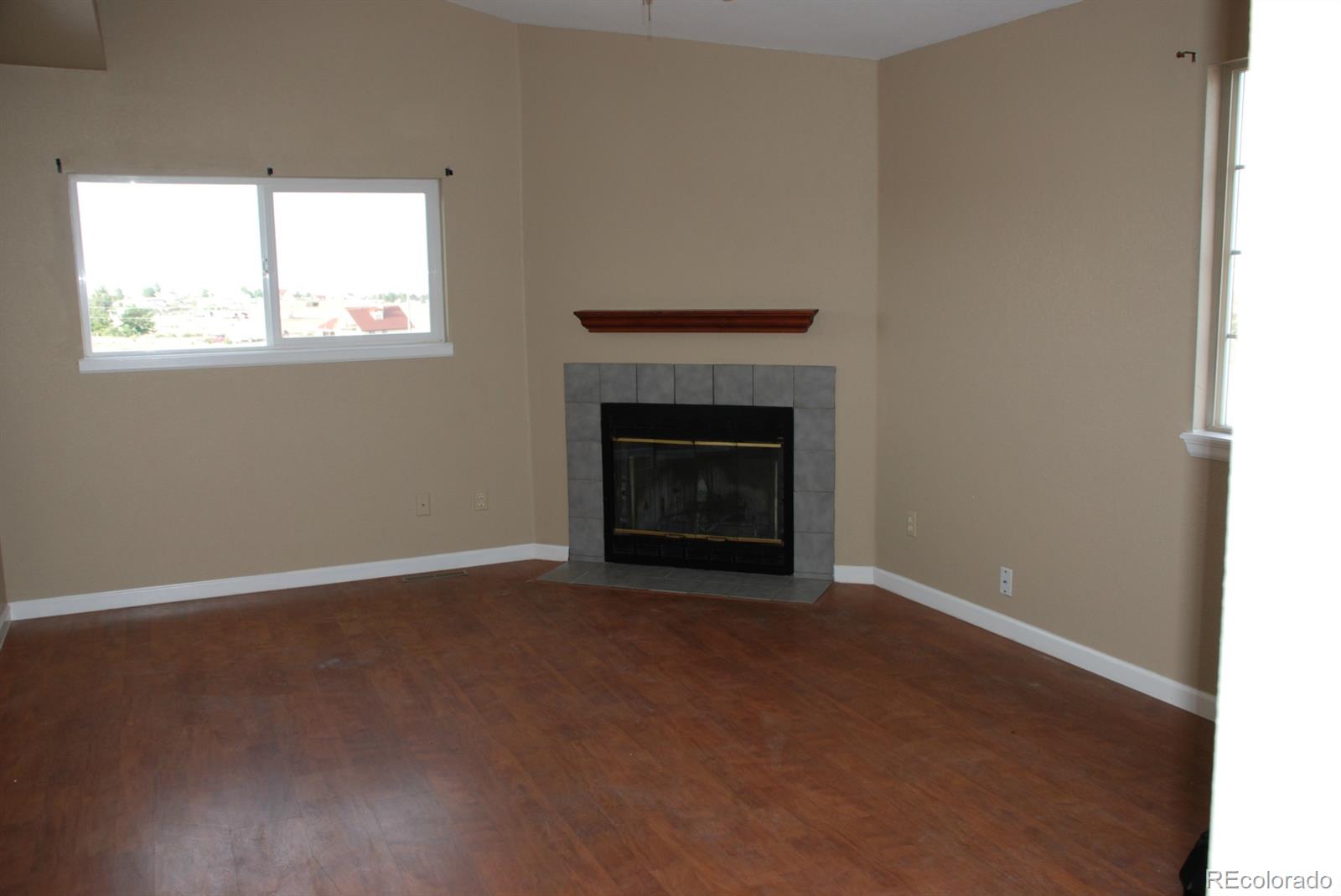 8979 Lariat Loop Elizabeth, CO 80107 - Photo 8 of 17 an empty room with windows