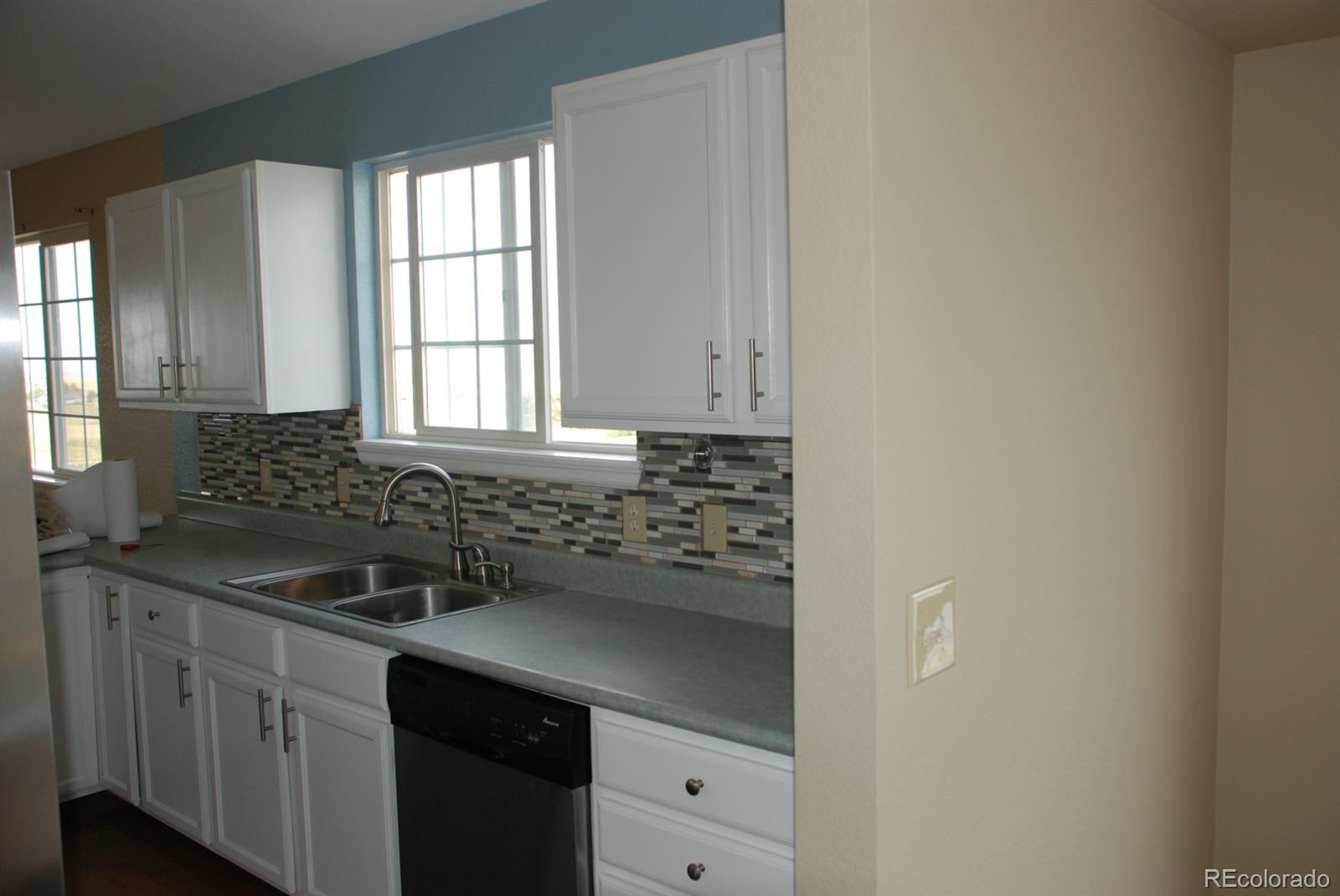 8979 Lariat Loop Elizabeth, CO 80107 - Photo 10 of 17 a kitchen with a sink and cabinets