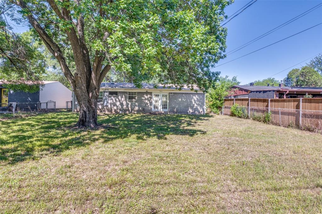 4312 Ridgedale Drive Mesquite, TX 75150 - Photo 20 of 23 a view of a backyard with a tree