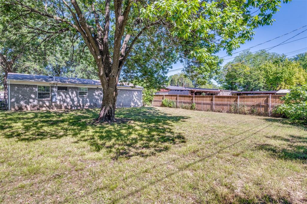 4312 Ridgedale Drive Mesquite, TX 75150 - Photo 21 of 23 a view of house with backyard and a tree