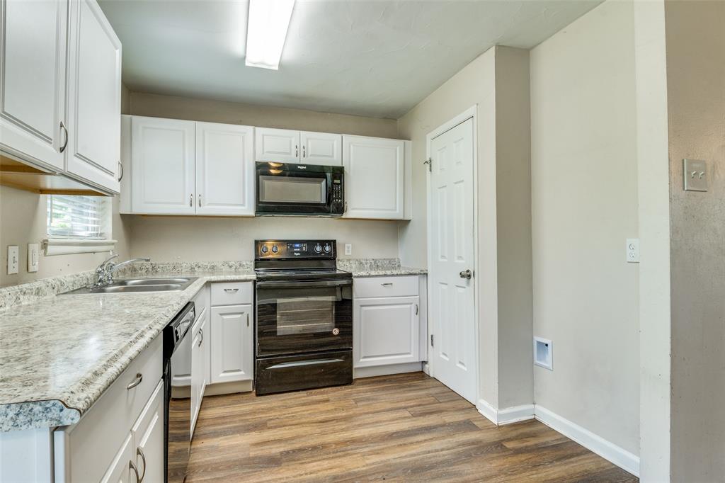 4312 Ridgedale Drive Mesquite, TX 75150 - Photo 7 of 23 a kitchen with stainless steel appliances granite countertop a stove and a refrigerator
