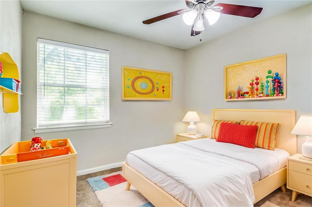 4312 Ridgedale Drive Mesquite, TX 75150 - Photo 8 of 23 a bedroom with a bed and a chandelier