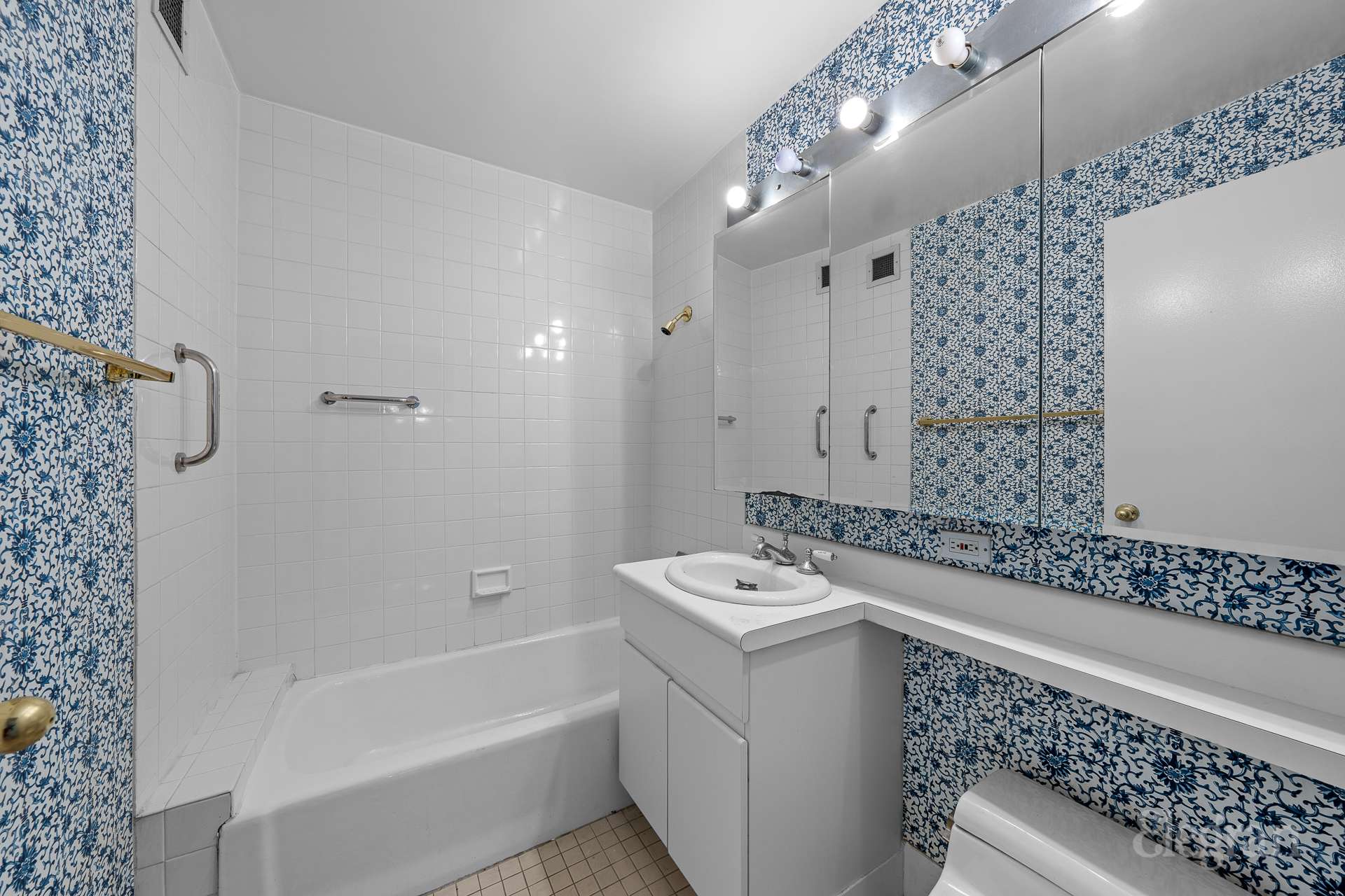 112-01 Queens Boulevard, Unit 16F Queens, NY 11375 - Photo 10 of 24 a bathroom with a sink a toilet and shower