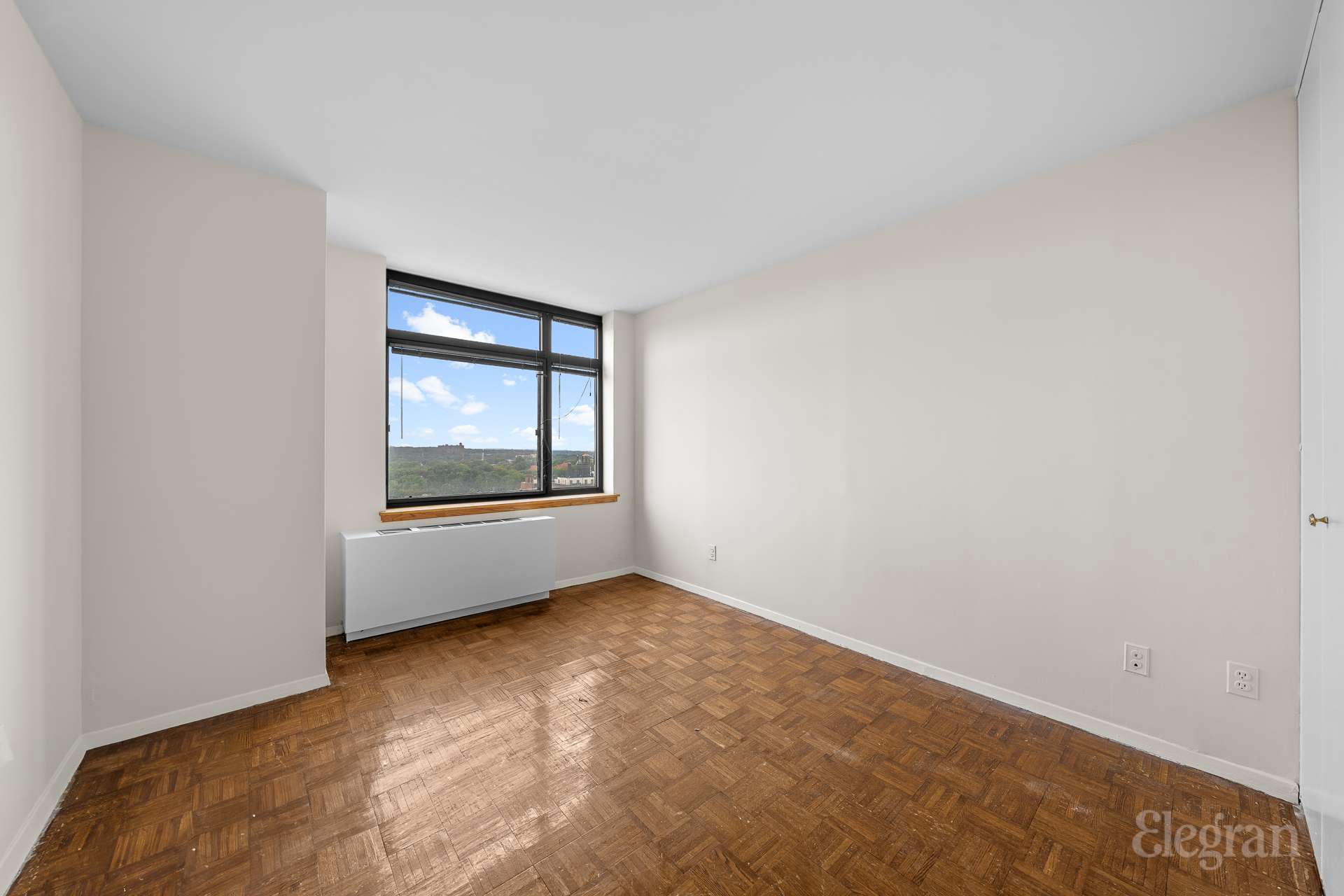 112-01 Queens Boulevard, Unit 16F Queens, NY 11375 - Photo 11 of 24 a view of an empty room with a window