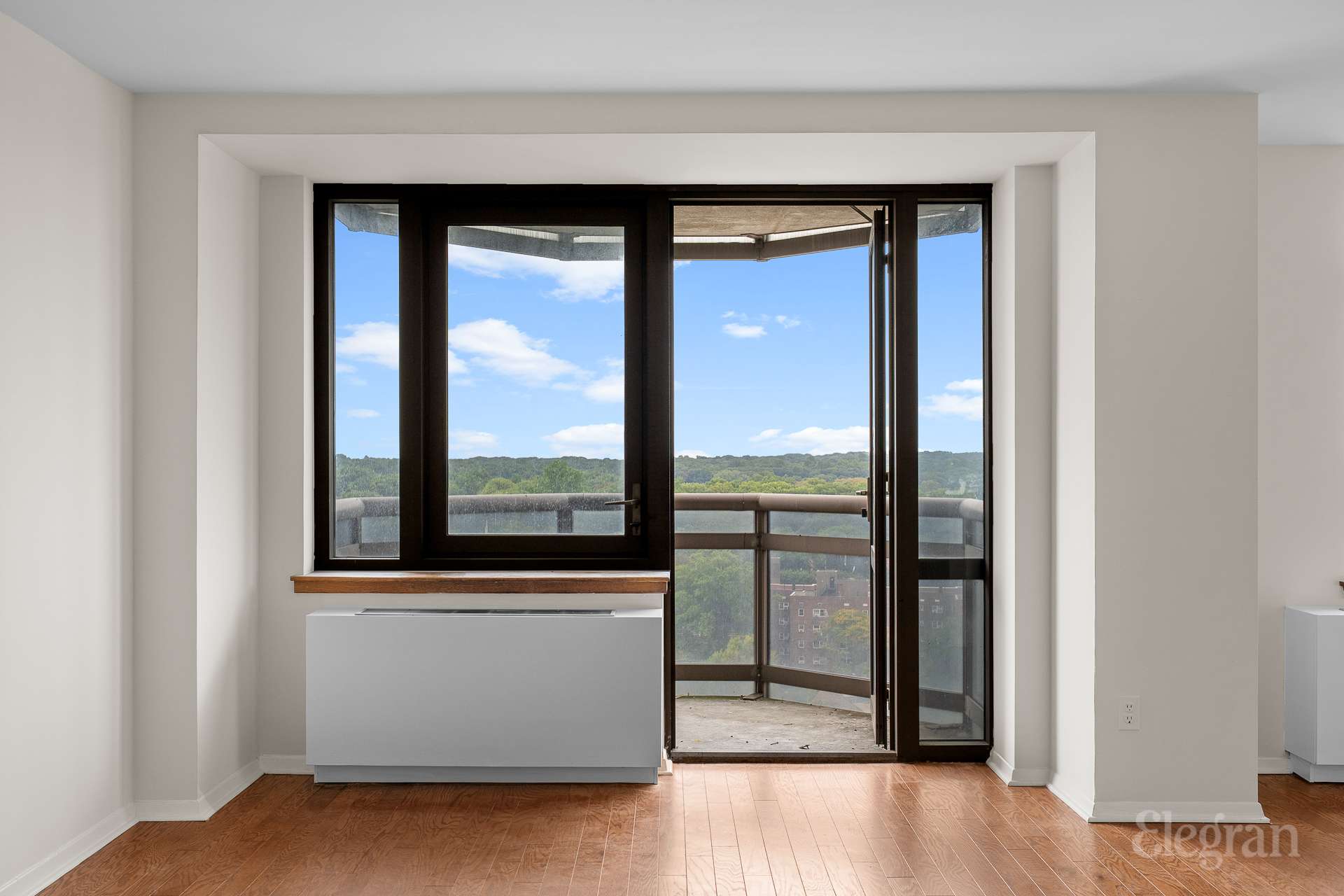 112-01 Queens Boulevard, Unit 16F Queens, NY 11375 - Photo 13 of 24 a view of a room that has a large window