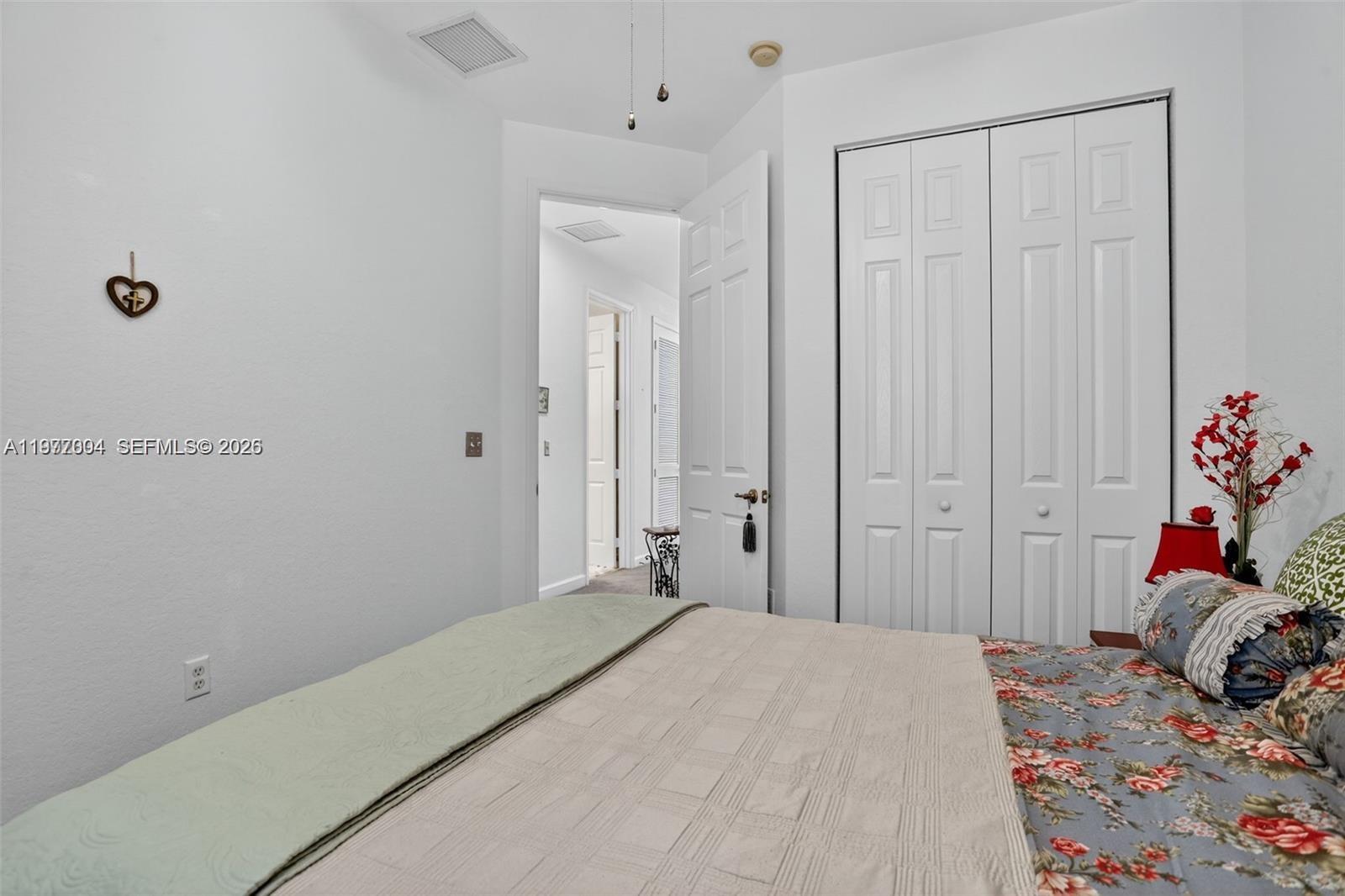 728 Southeast 2nd Street Pompano Beach, FL 33060 - Photo 15 of 22 a bedroom with a bed and a closet