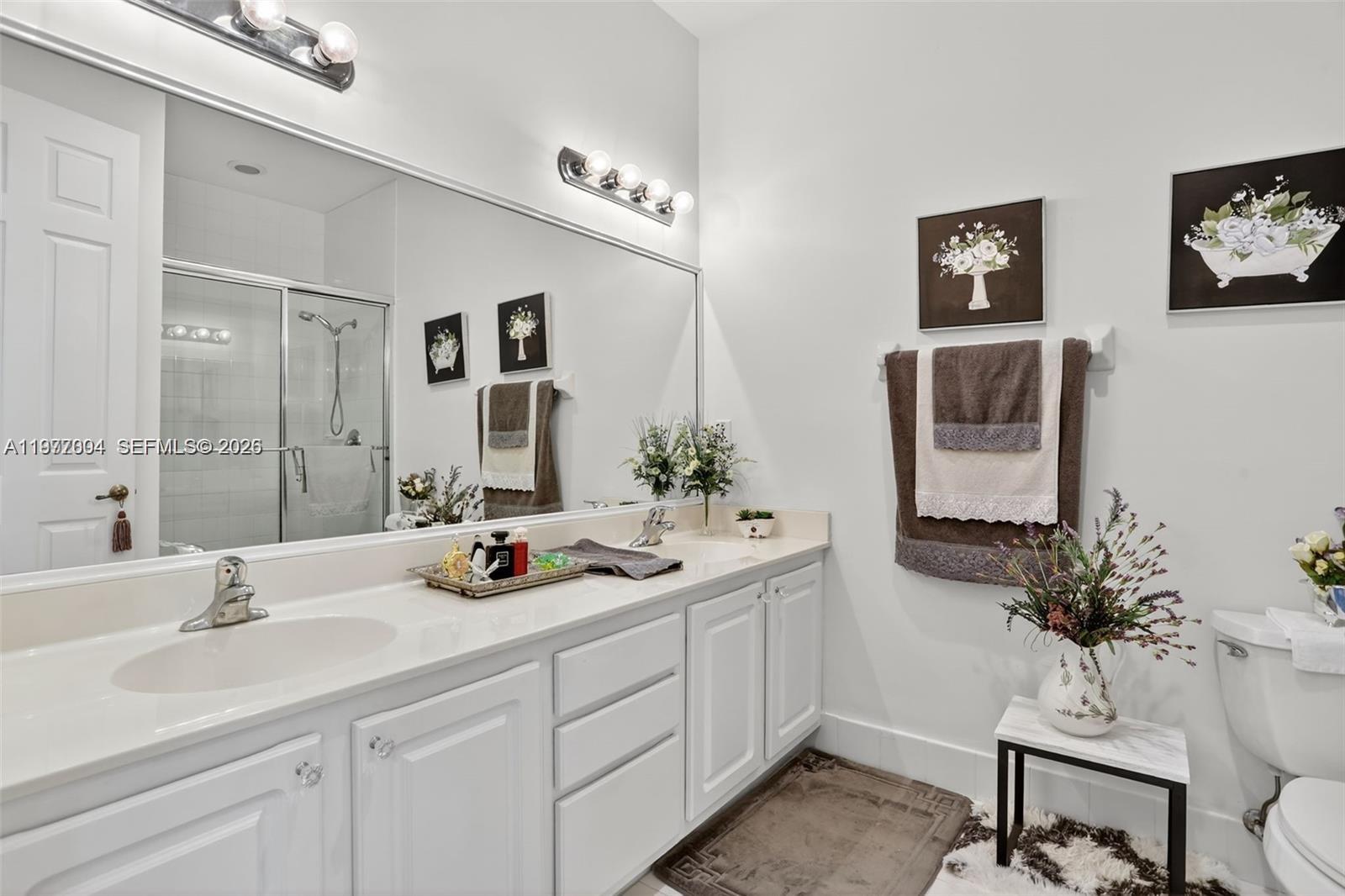 728 Southeast 2nd Street Pompano Beach, FL 33060 - Photo 16 of 22 a bathroom with 2 sink and a mirror